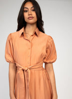 An'ge – Malida Maxi Dress Terracotta, model wearing a peach-coloured midi shirt dress, front view