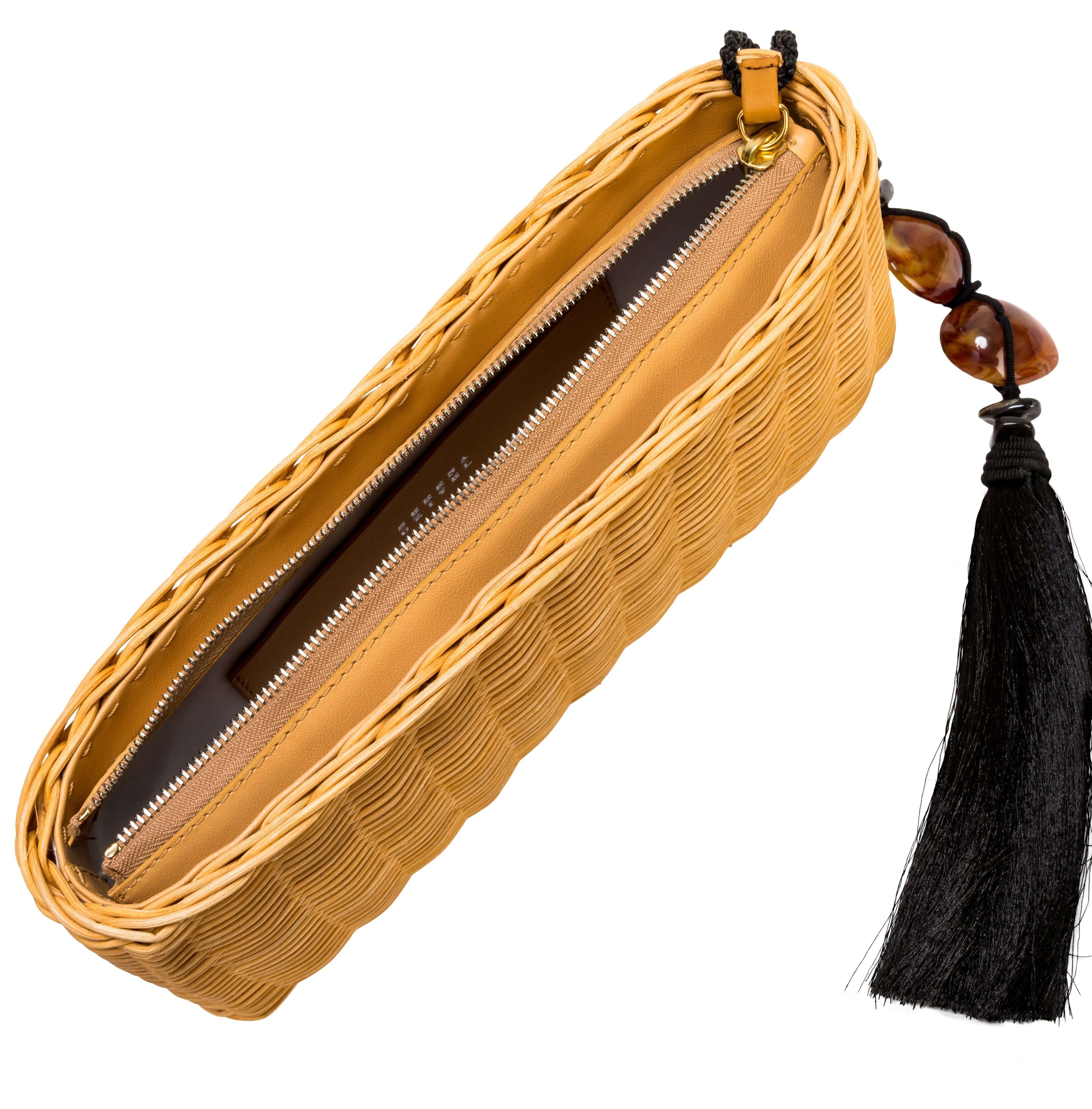 Melita Natural Clutch in raffia with leather lining and natural stone tassel closure, perfect for summer nights.