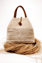 Elegant Melita Natural Large Tote Bag in woven raffia with silk tassel, perfect for summer style and retro-chic looks.