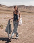 The Black Asymmetrical Top The Blue Straight Slit Jeans The Me Necklace The Light Large Canvas Ba...