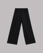 Black wide-leg pants on a gray background