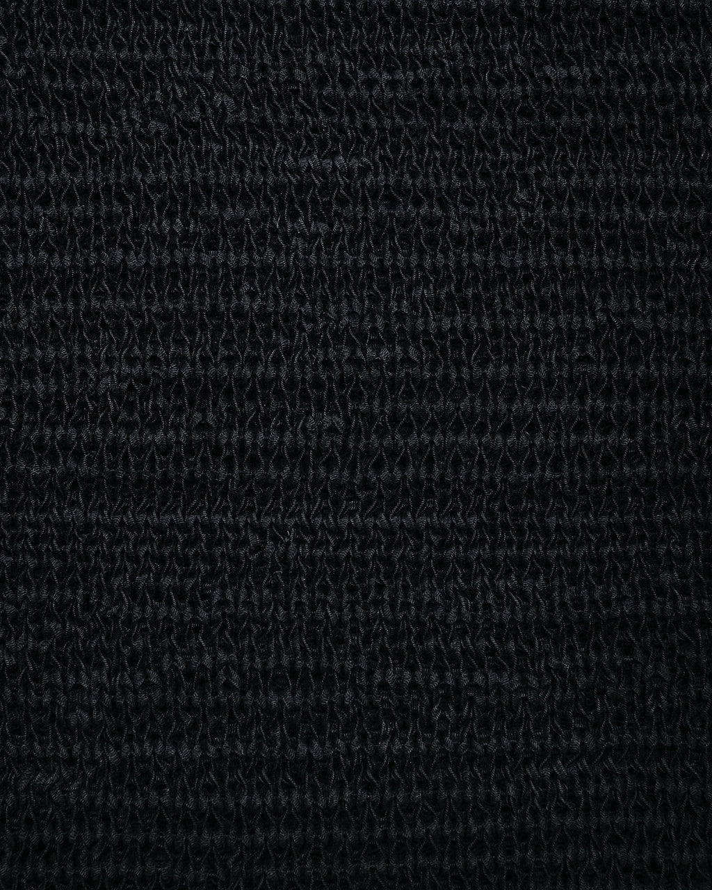 El vestido negro de punto con espalda escotada y manga larga El top negro de punto El chaleco negro de punto El...