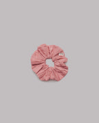 Pink scrunchie on a gray background