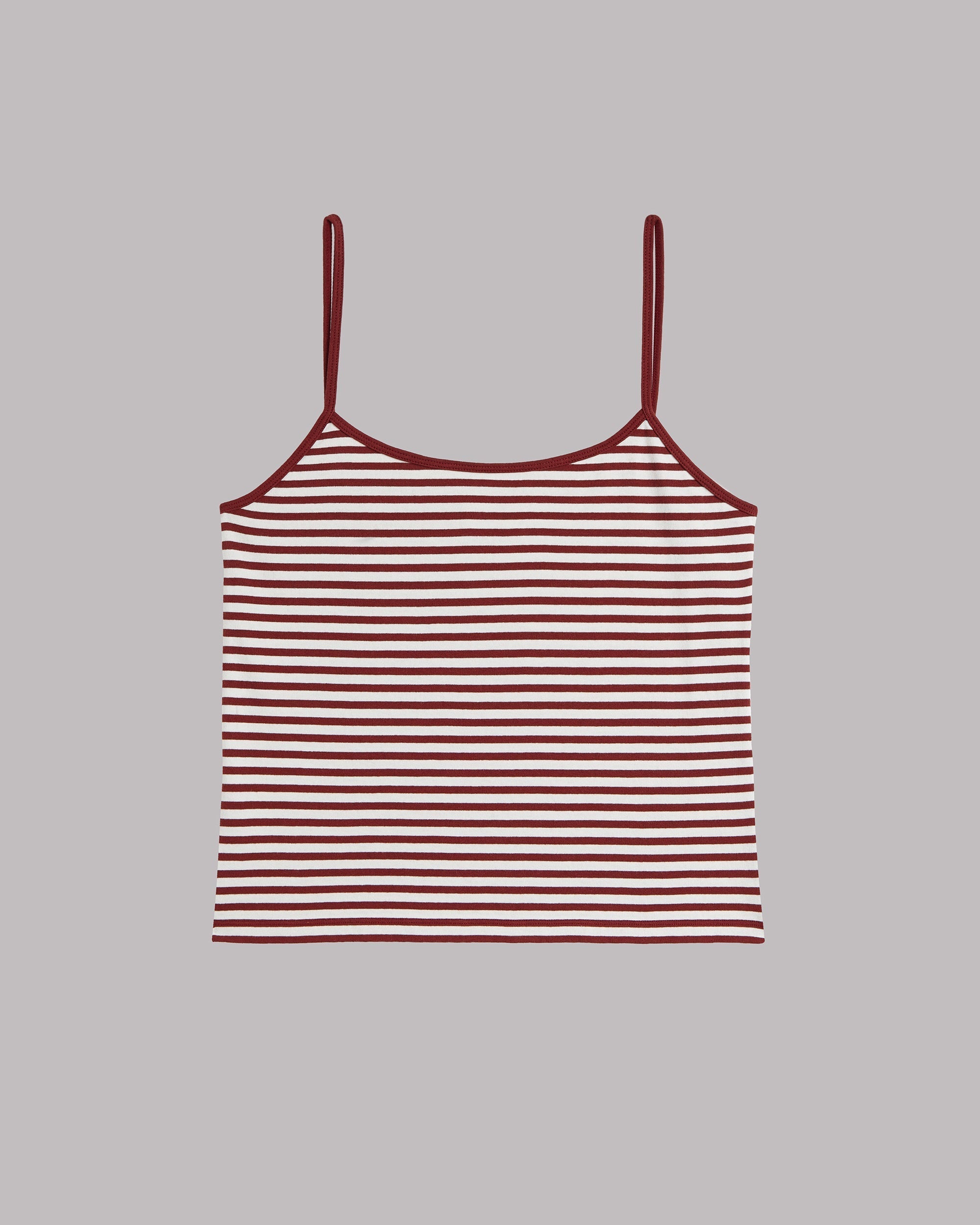 Striped tank top with thin straps on a gray background
