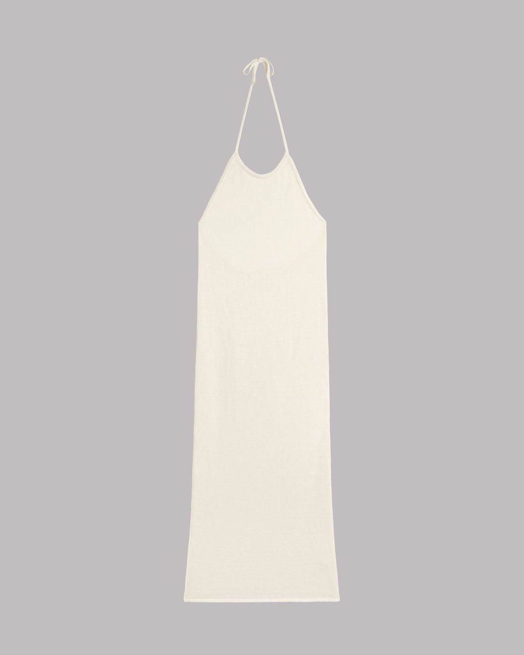 White slip dress on a gray background