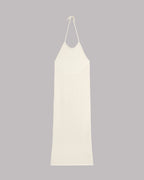 White slip dress on a gray background