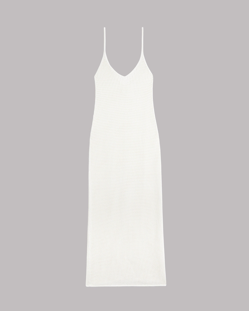 Vestido de punto lencero blanco sobre fondo gris