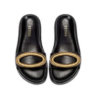 Naria Black Comfort Slide featuring a stylish golden accent on a sleek black design for ultimate comfort and elegance.