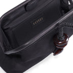 Inside view of the Petra Black Pouch Bag, featuring a suede leather interior and stylish detail.