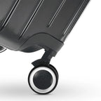 360° double wheel of the GYL Intemporelle dark grey suitcase with GYL logo engraved on the hub. #couleur_gris foncé