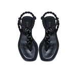 Thory Black Flat Sandal featuring braided metallic thread straps and premium leather sole for a chic summer look.