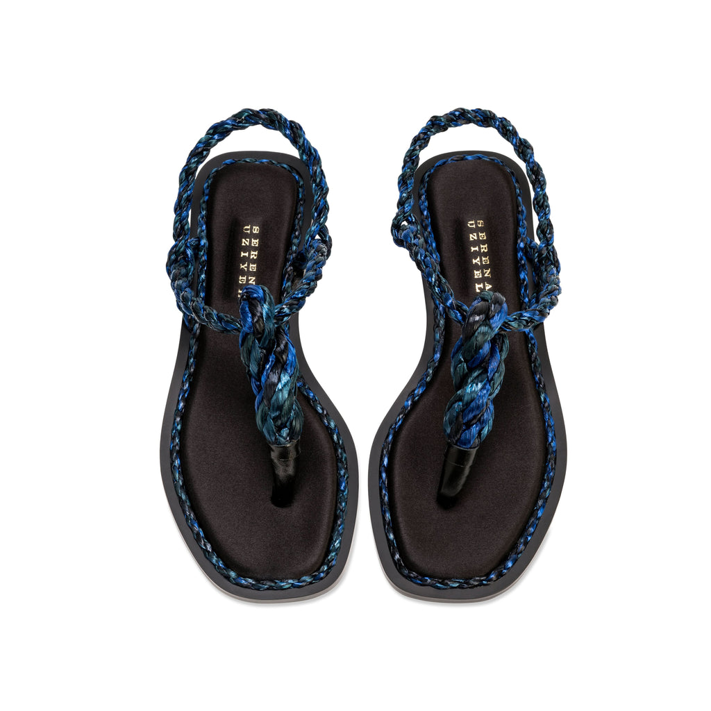 Thory Navy Flat Sandal featuring silk satin and navy raffia braiding, offering elegance in a minimal design.
