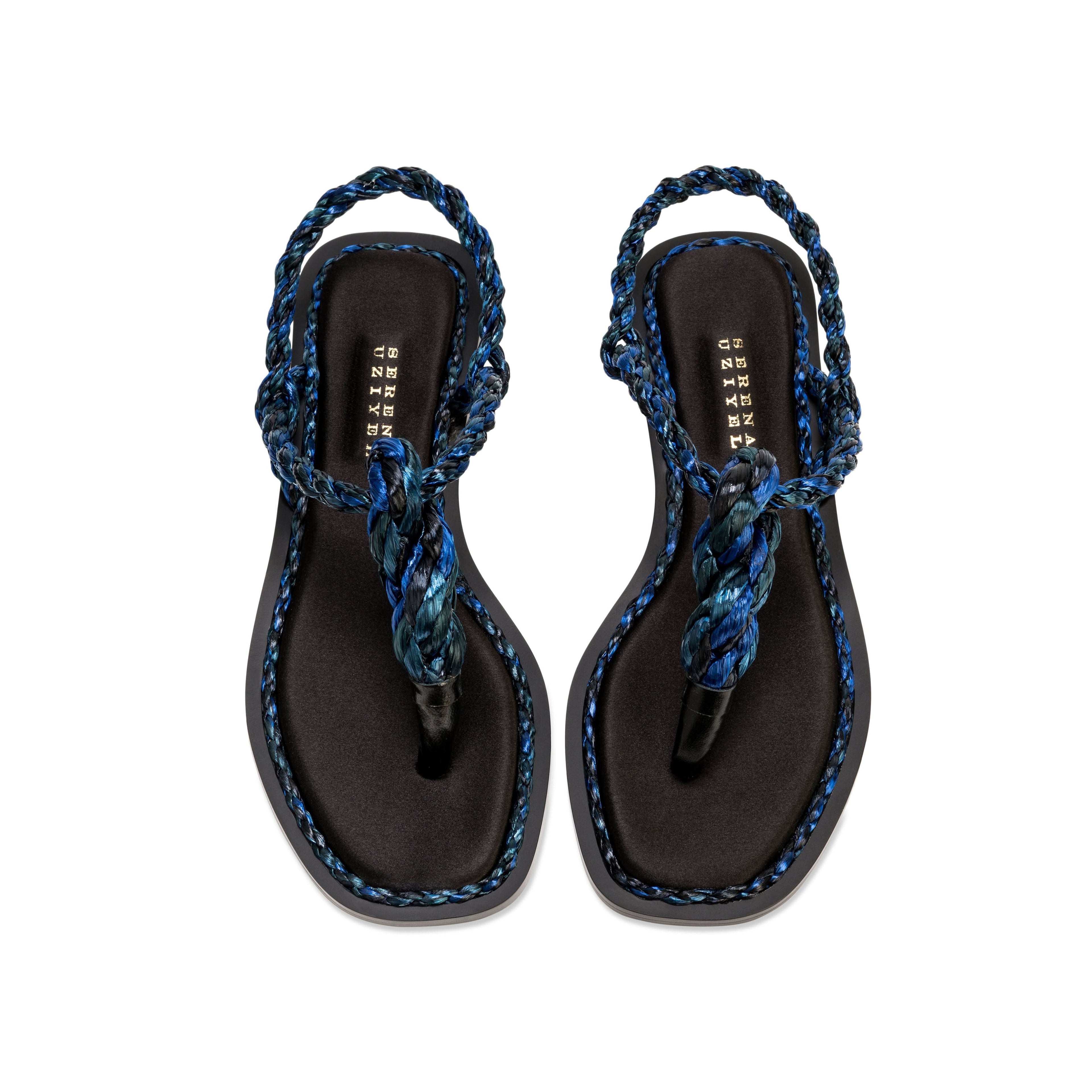 Thory Navy Flat Sandal featuring silk satin and navy raffia braiding, offering elegance in a minimal design.